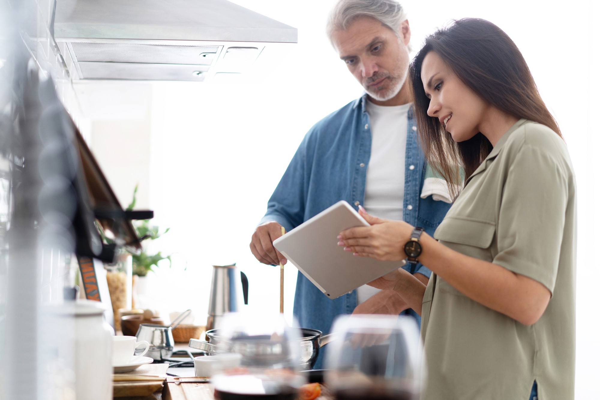 Consultation with chef and client in modern kitchen
